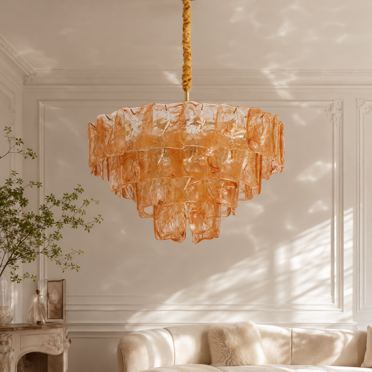 The Clementine chandelier with blue glass panels hanging in a modern dining room.