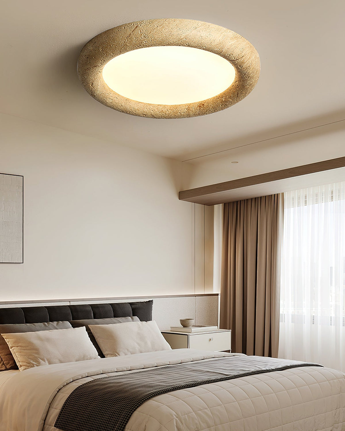 The beige ceiling light mounted in a modern bedroom with minimalist decor.