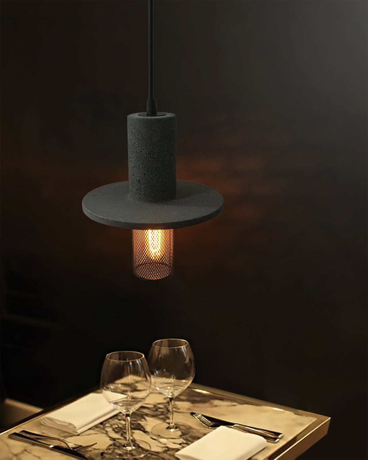 The Condo Pendant Light illuminated, casting a warm glow.