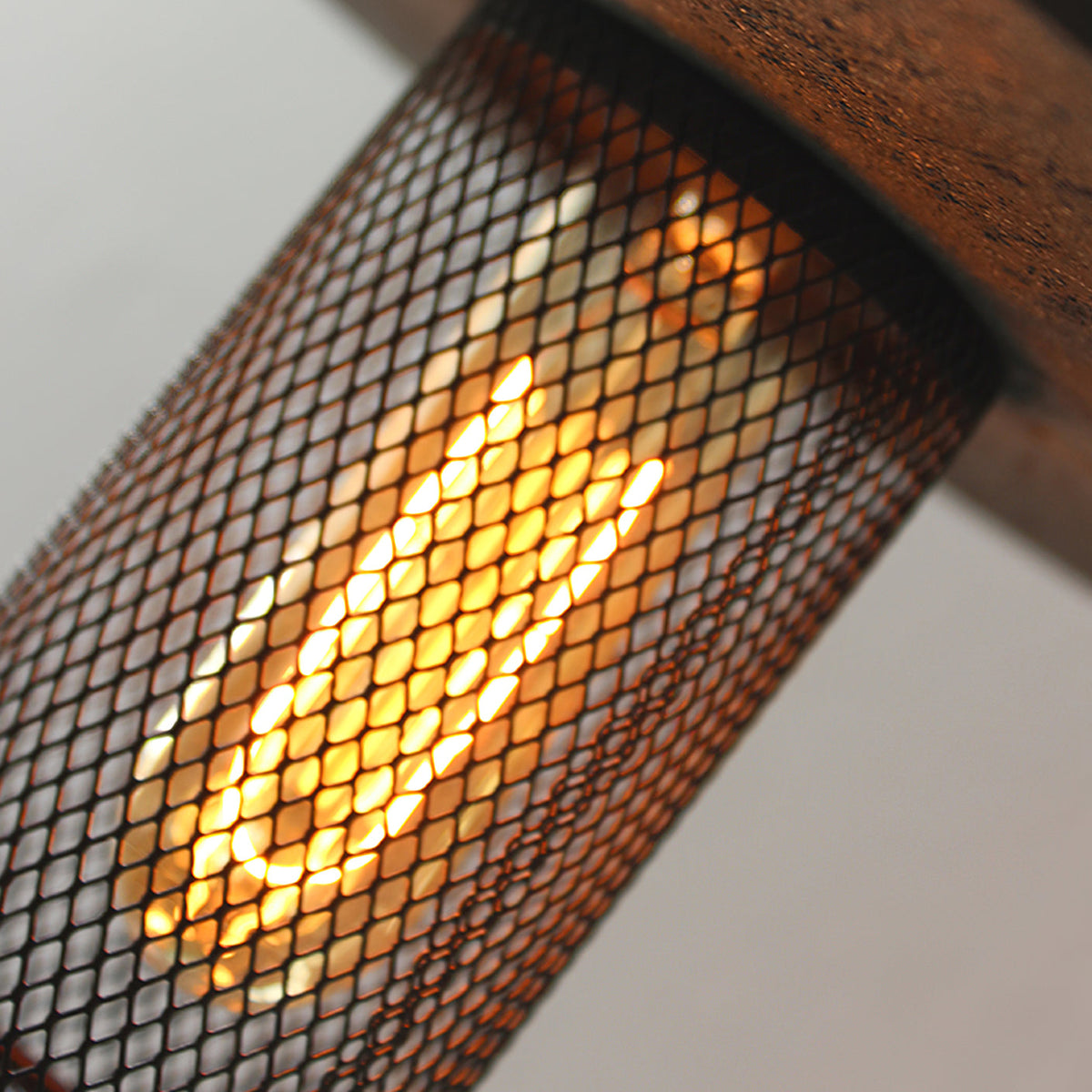 Detailed shot of the metal mesh diffuser on the Condo Pendant Light.