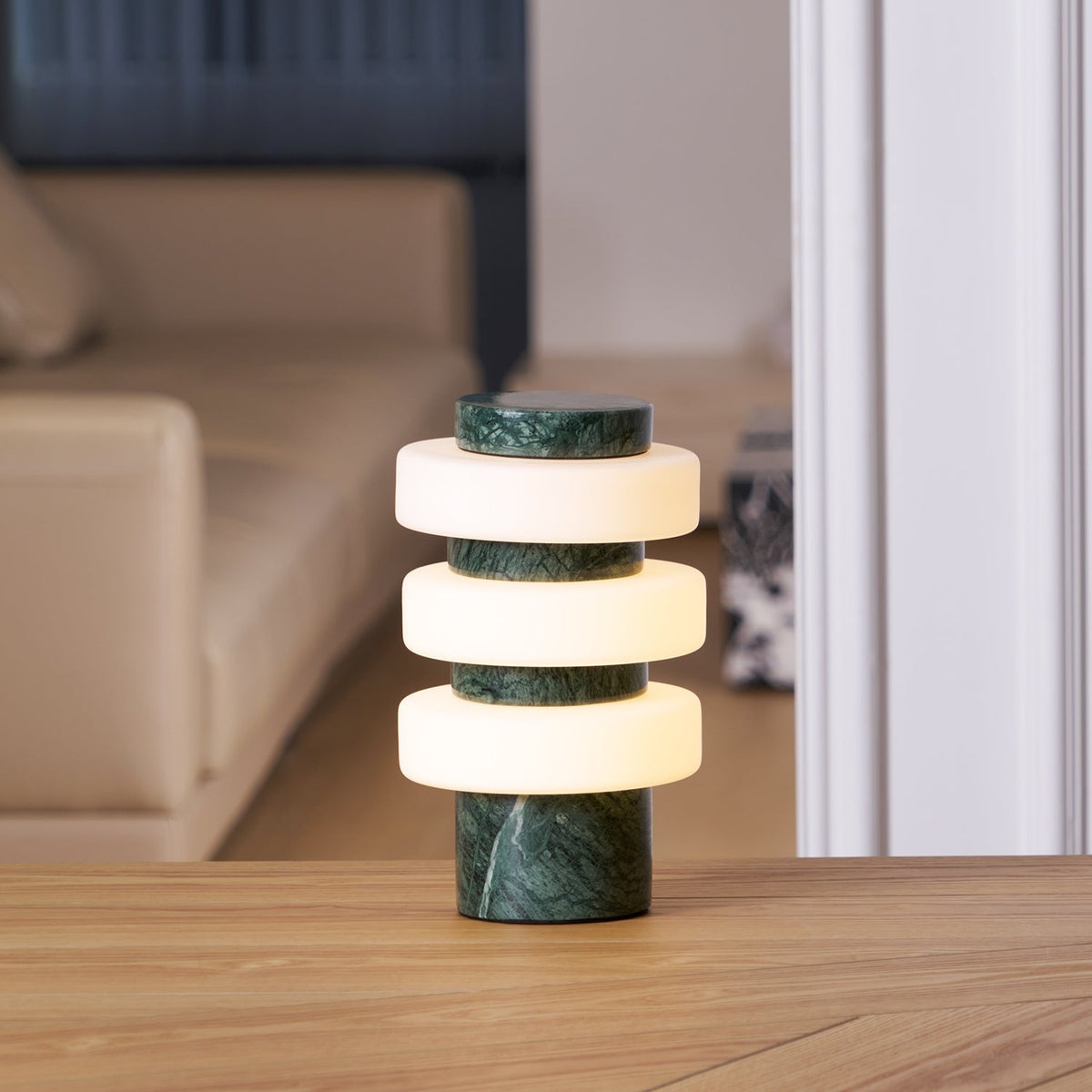 Corba Table Lamp in white on a side table.