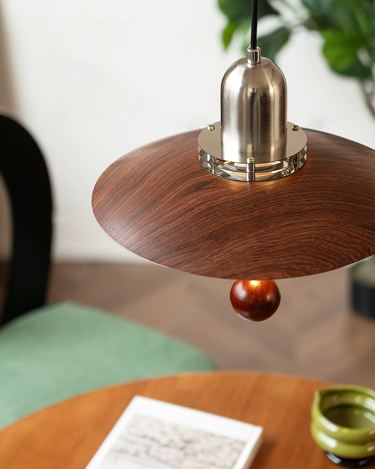 Cullen Pendant Light shown in a living room setting, providing focused light.