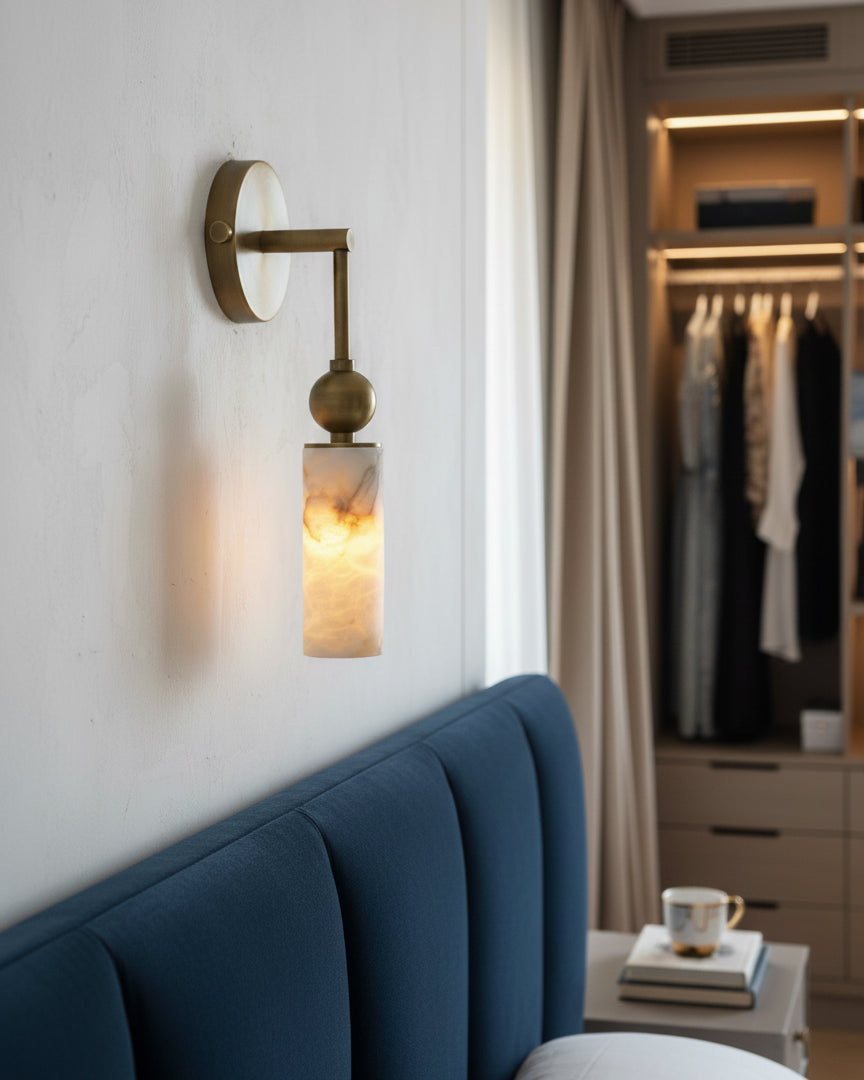 The 2-head Metro Alabaster Wall Lamp illuminating a hallway.