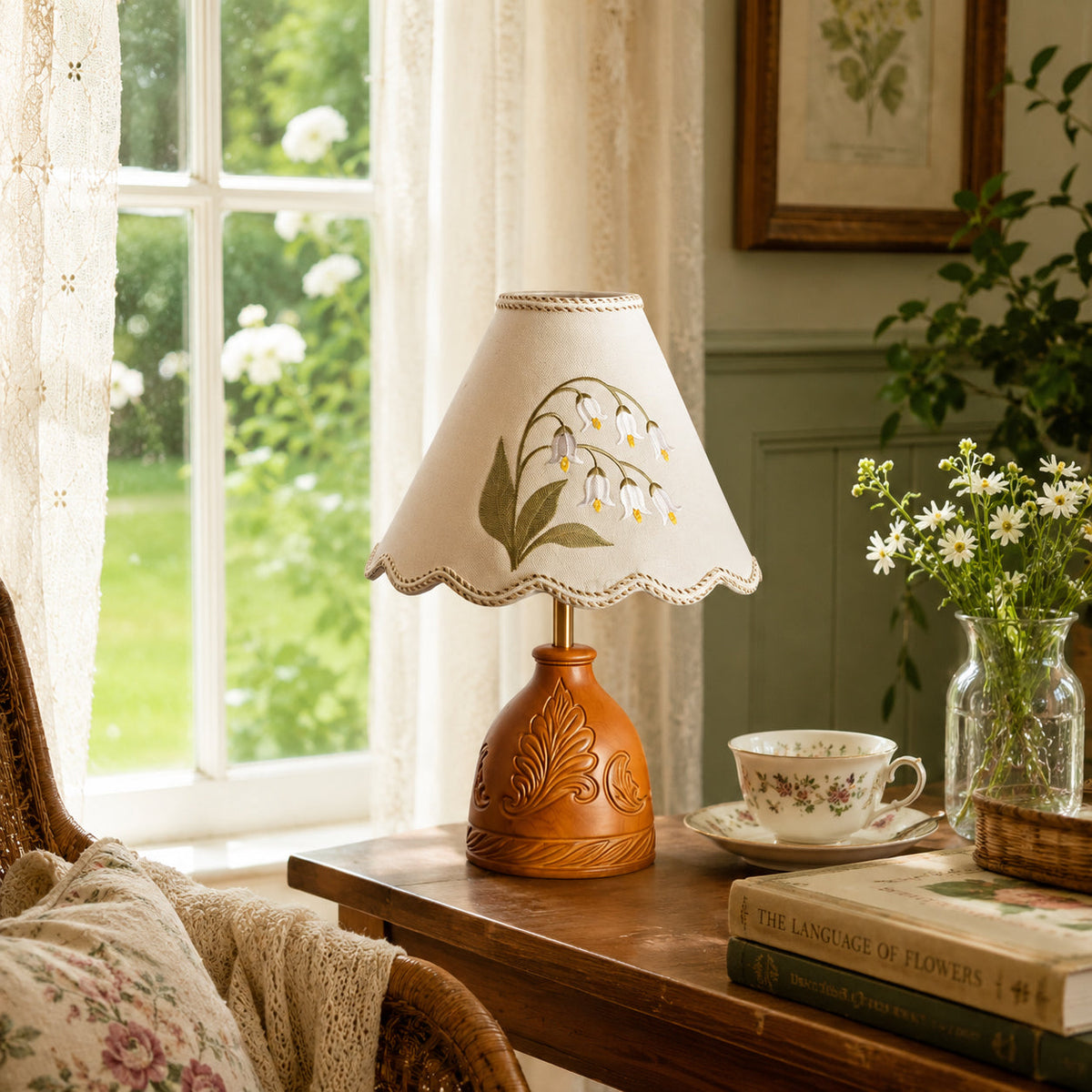 Maisie Table Lamp shown on a bedroom nightstand, providing warm light.