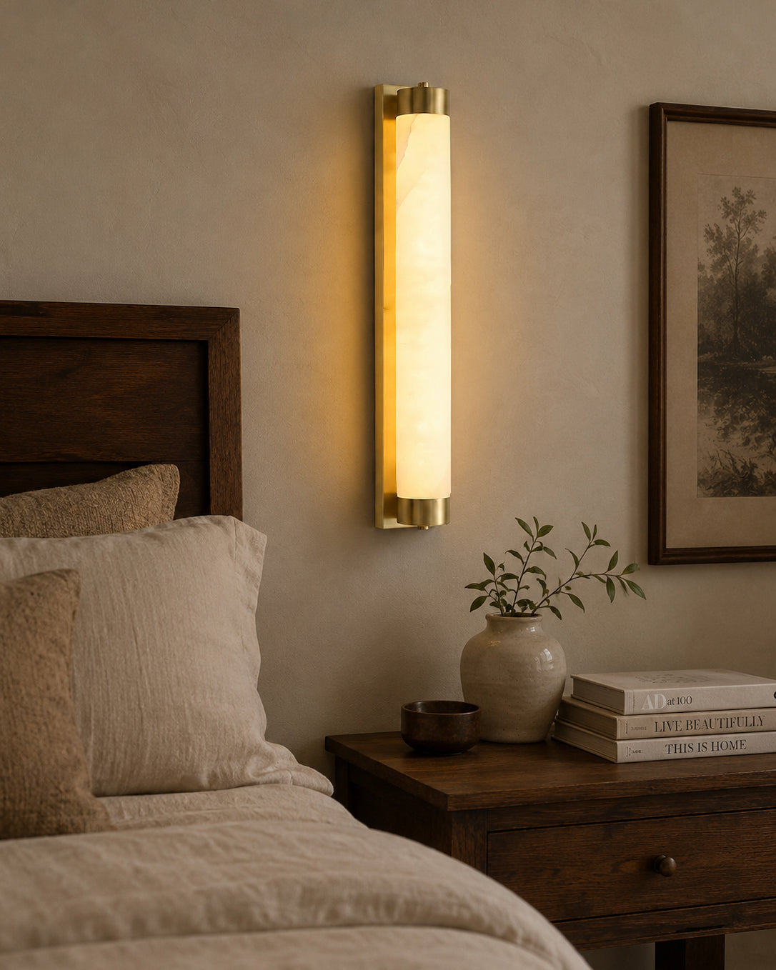 The Langham Alabaster Wall Sconce in a sleek black finish.