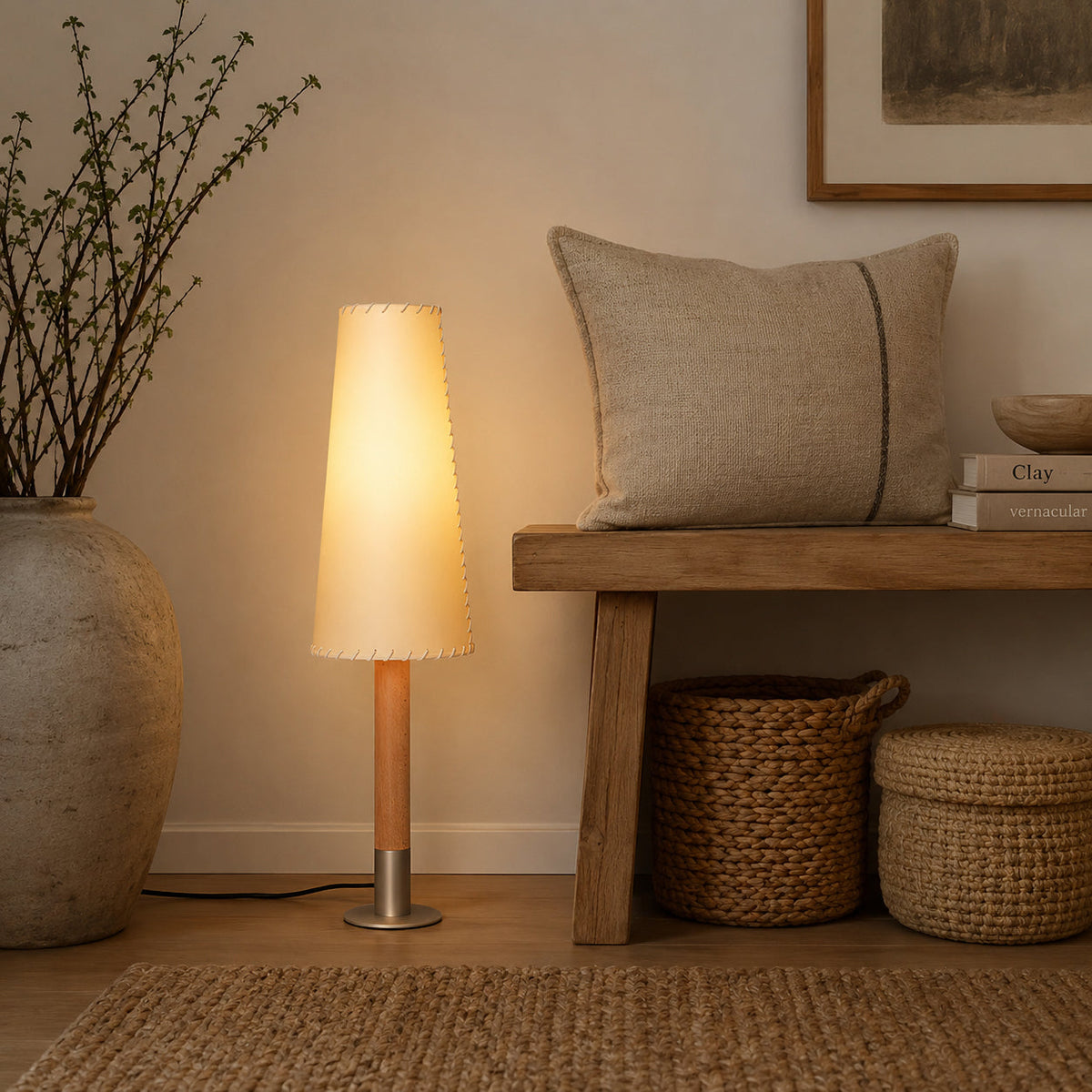 The floor lamp providing ambient light in a cozy bedroom corner.