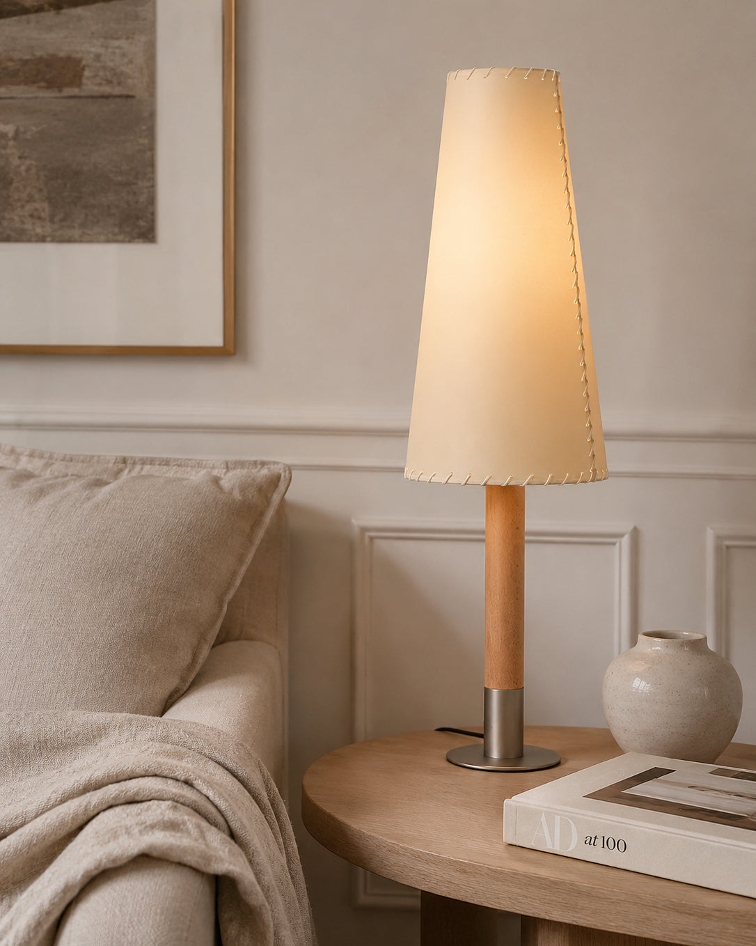 The lamp shown against a neutral wall to highlight its form.