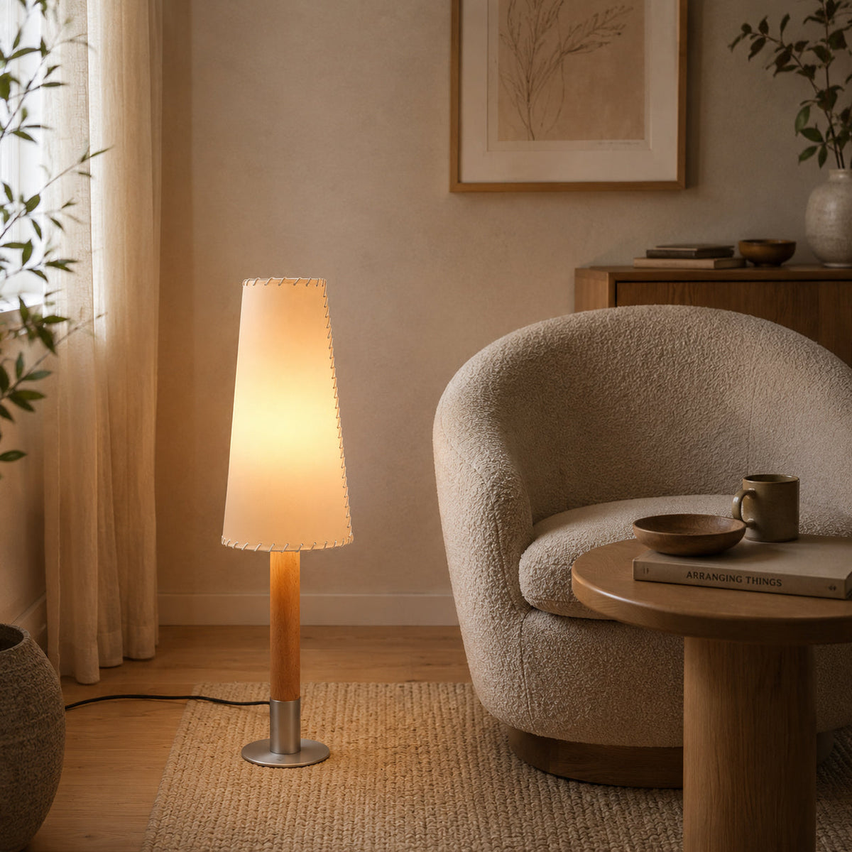 The brushed metal base of the Kove Parchment Floor Lamp.