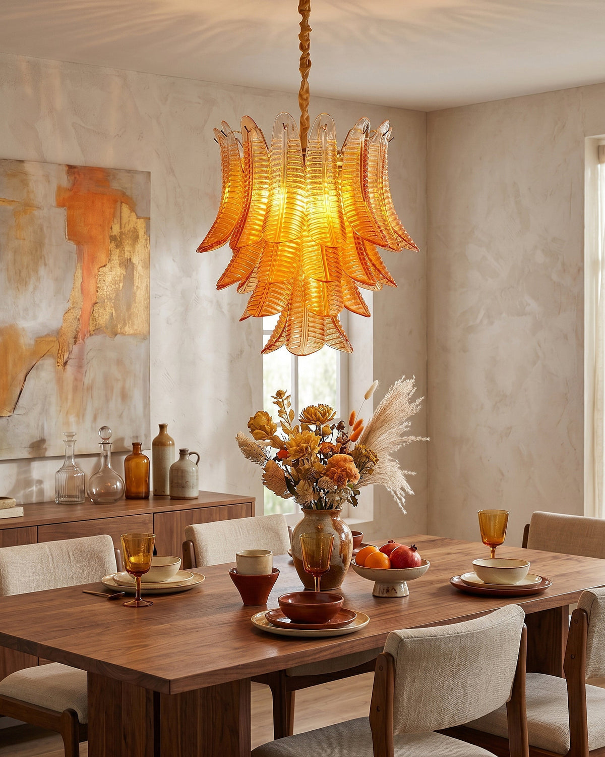 The luxurious gold-finished metal details of the Isolde Glass Chandelier.