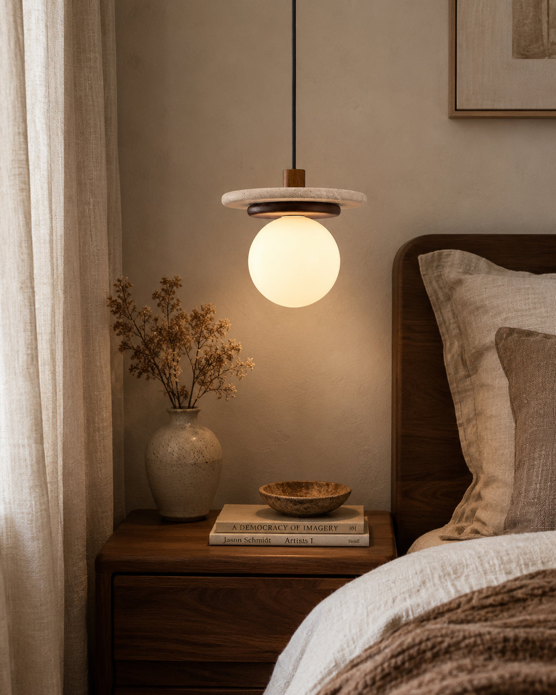 A series of three Farren pendant lights hanging over a modern kitchen island.