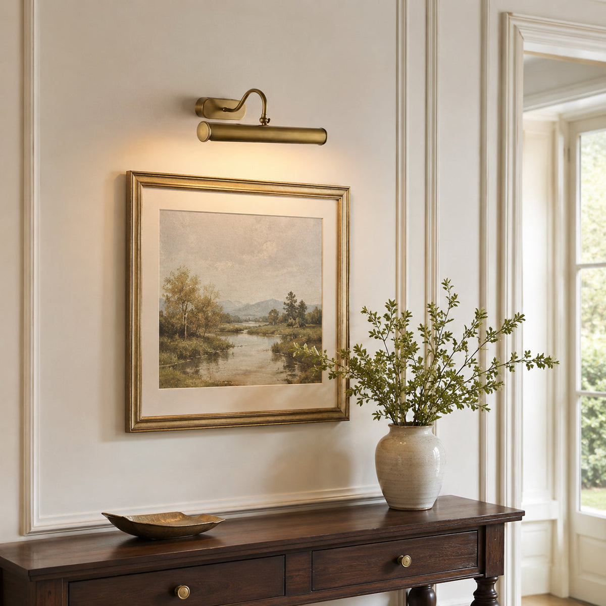 Ainsworth Wall Sconce installed above a modern painting in a gallery setting.