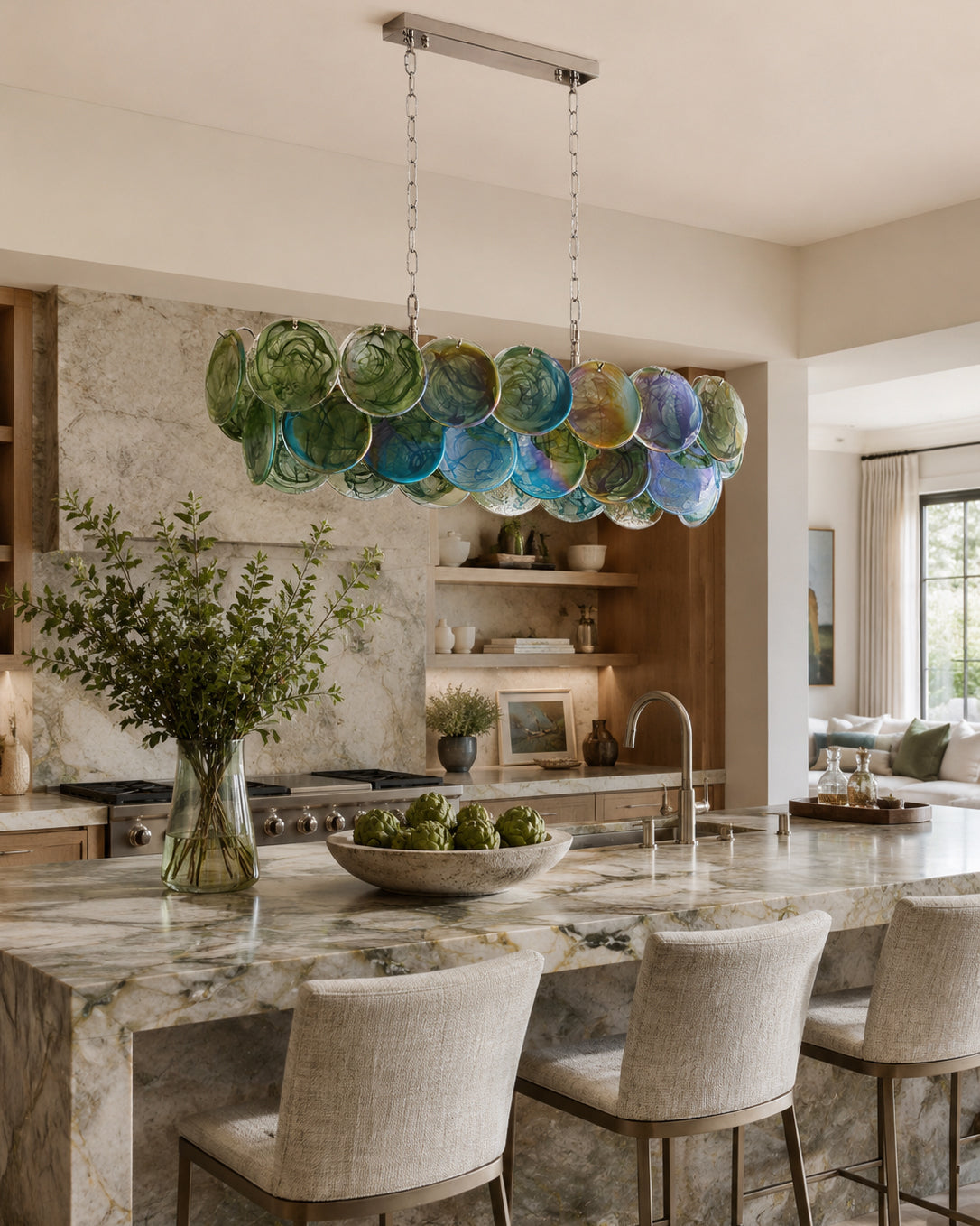 The Pavone Linear Chandelier in a soft pink glass finish.
