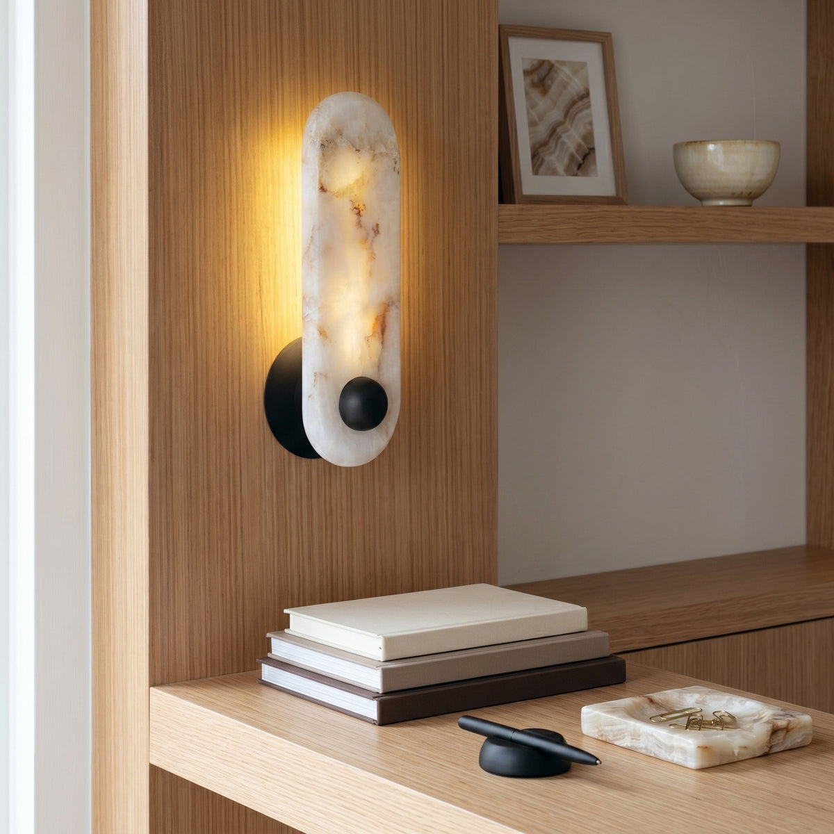 Close-up view of the Breuer Alabaster Wall Sconce, highlighting the natural stone veins.