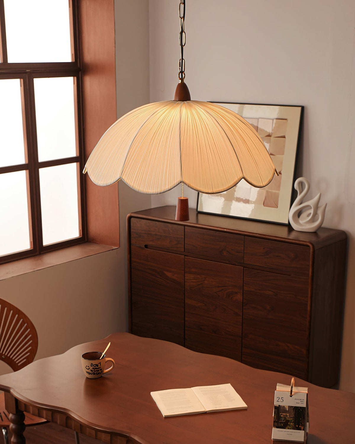 The Dawson Pendant Light illuminating a cozy living room space.