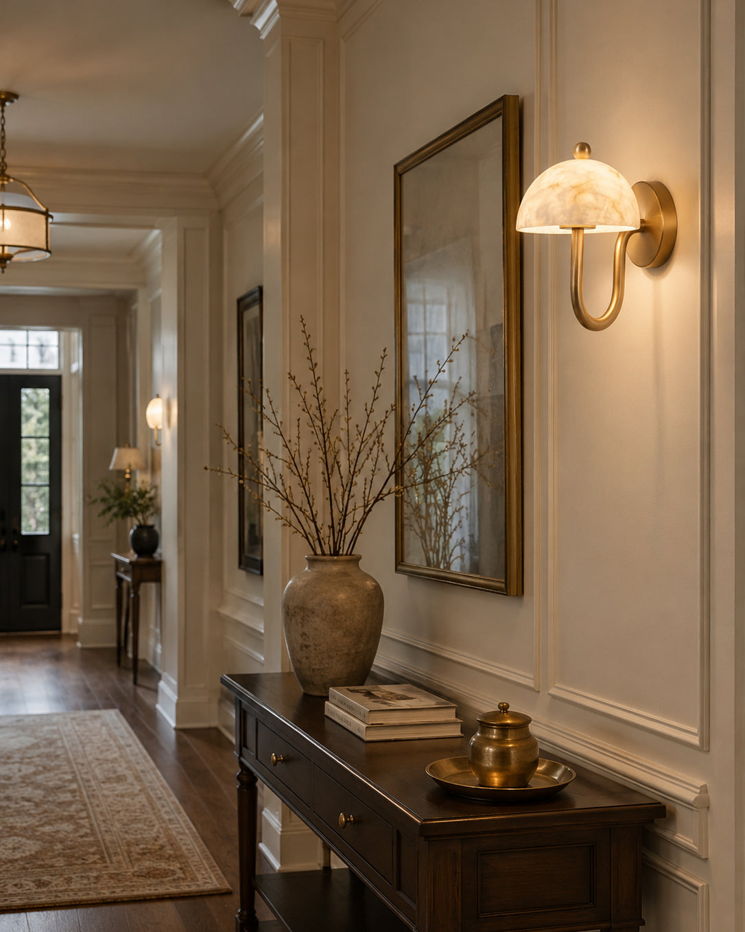 The sconce illuminated, casting a warm, soft glow through the alabaster.
