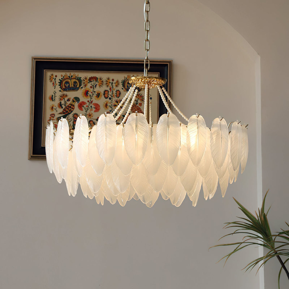 The Antheia Chandelier shown in a dining room, providing ambient light.