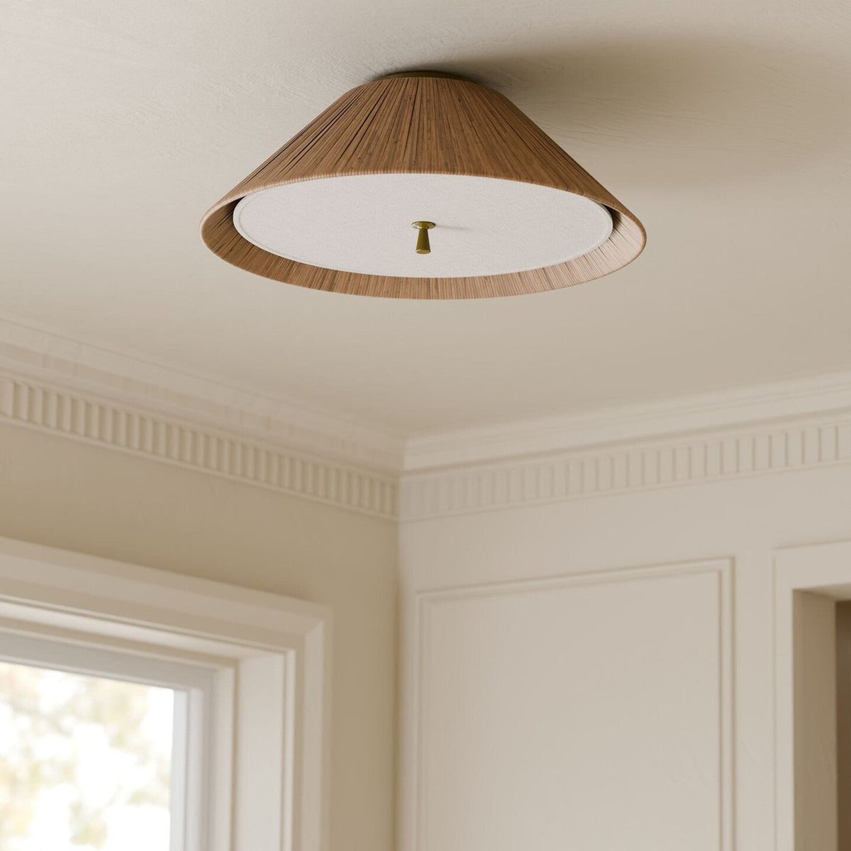 The Bodie Rattan Ceiling Mount installed in a modern bedroom with neutral decor.