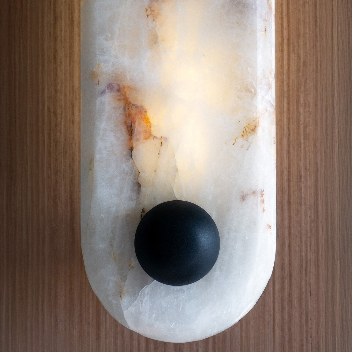 Side profile of the Breuer Alabaster Wall Sconce showing its projection from the wall.