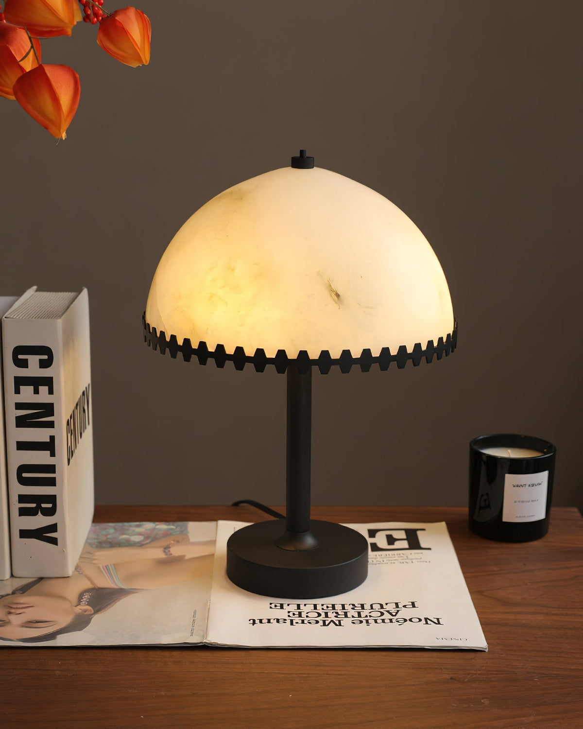 Bronson table lamp against a dark wall to highlight its glow.
