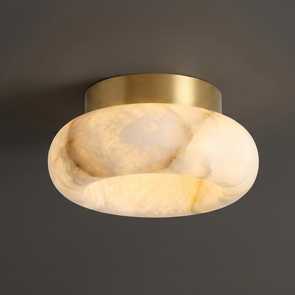The white and brass finish of the Cairns Alabaster Ceiling Lamp.