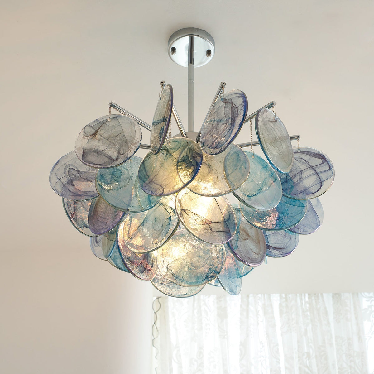 The Camisa Glass Chandelier creating an ambient glow.