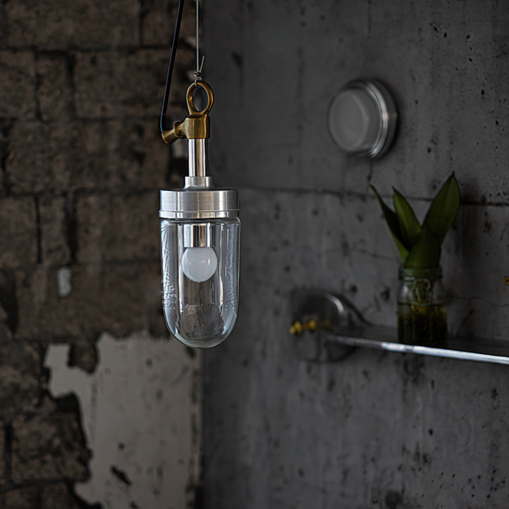 A row of Carson Capsule Pendant Lights hanging over a modern kitchen island.