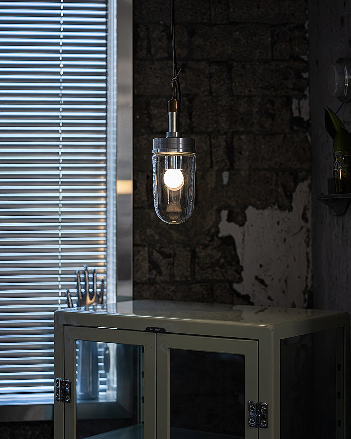 Carson Capsule Pendant Light used as vanity lighting in a bathroom setting.