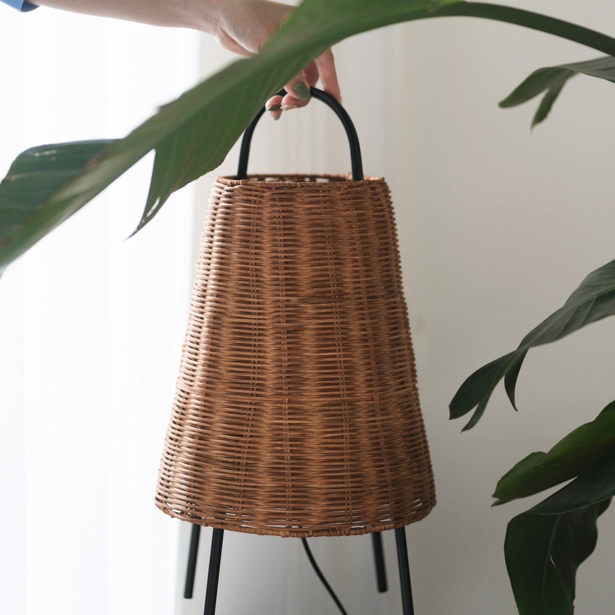 Close-up of the woven rattan texture on the Catalina table lamp.