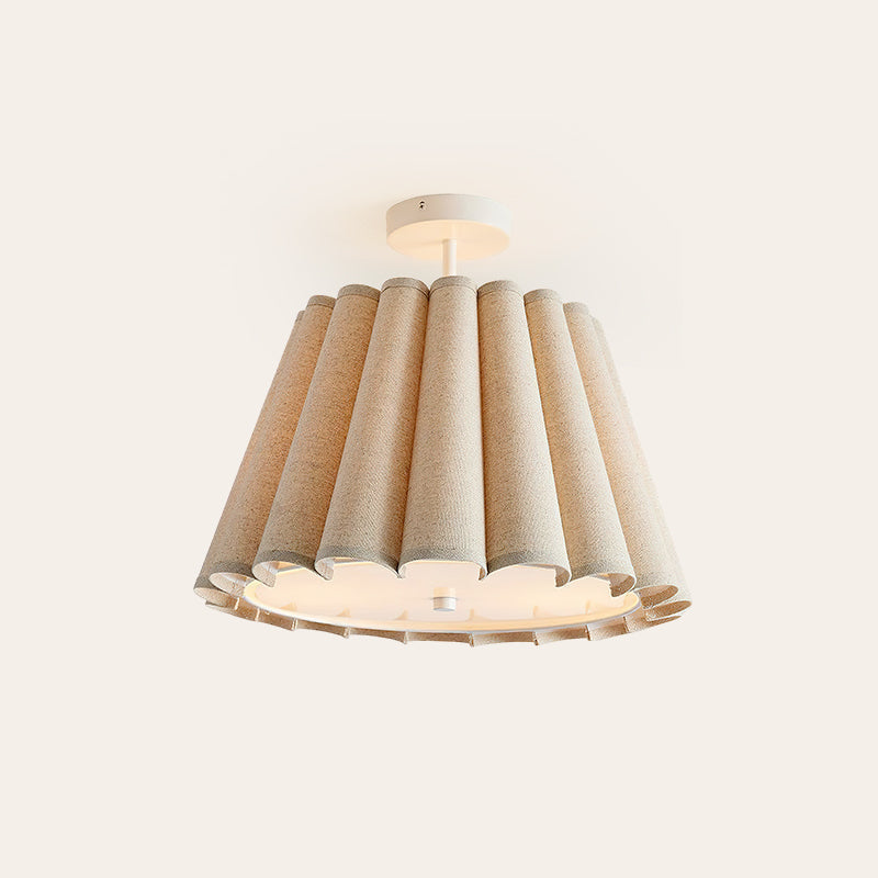 Lifestyle image showing the Colette flush mount in a cozy nursery setting.
