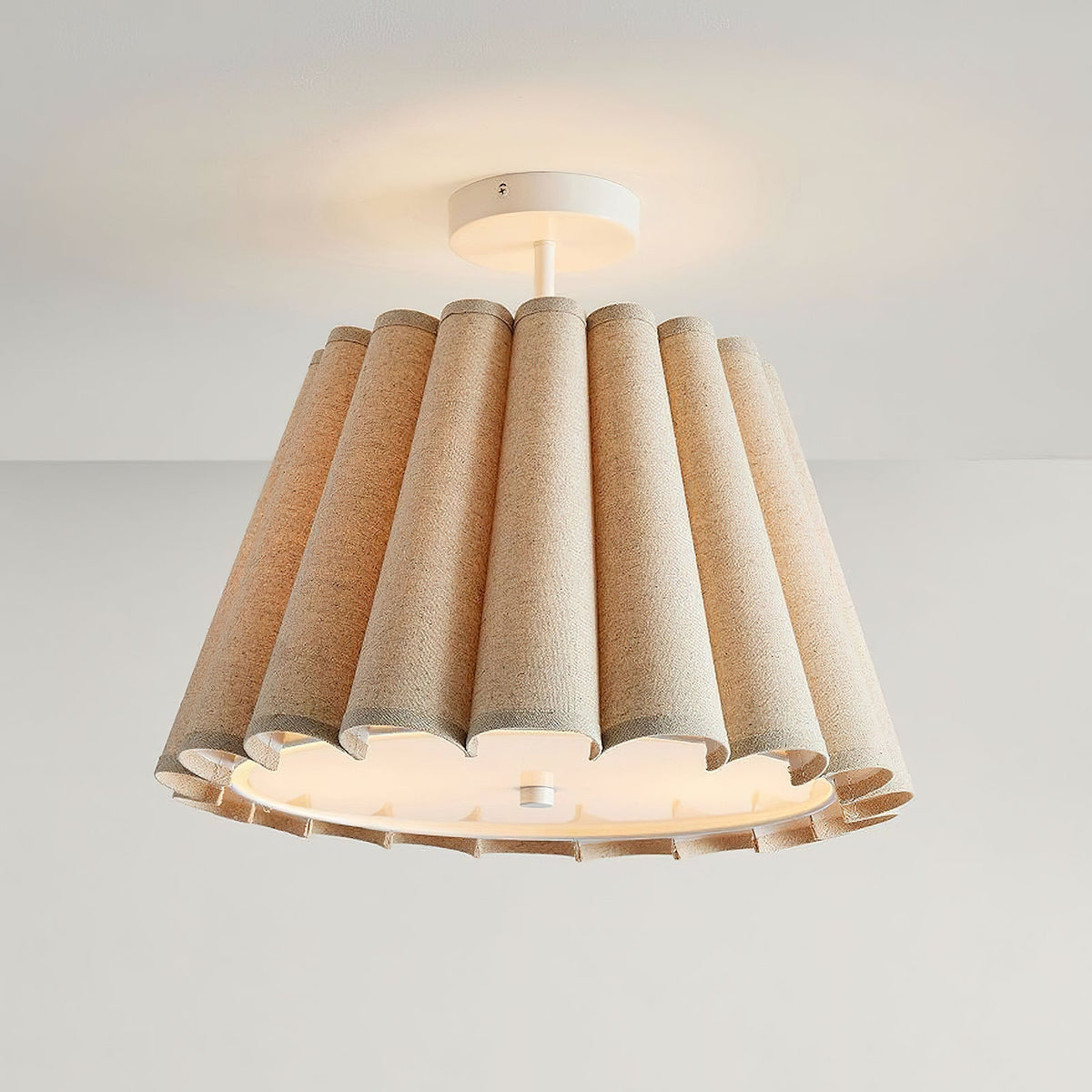Close-up view of the fabric and scalloped edge detail of the Colette flush mount.