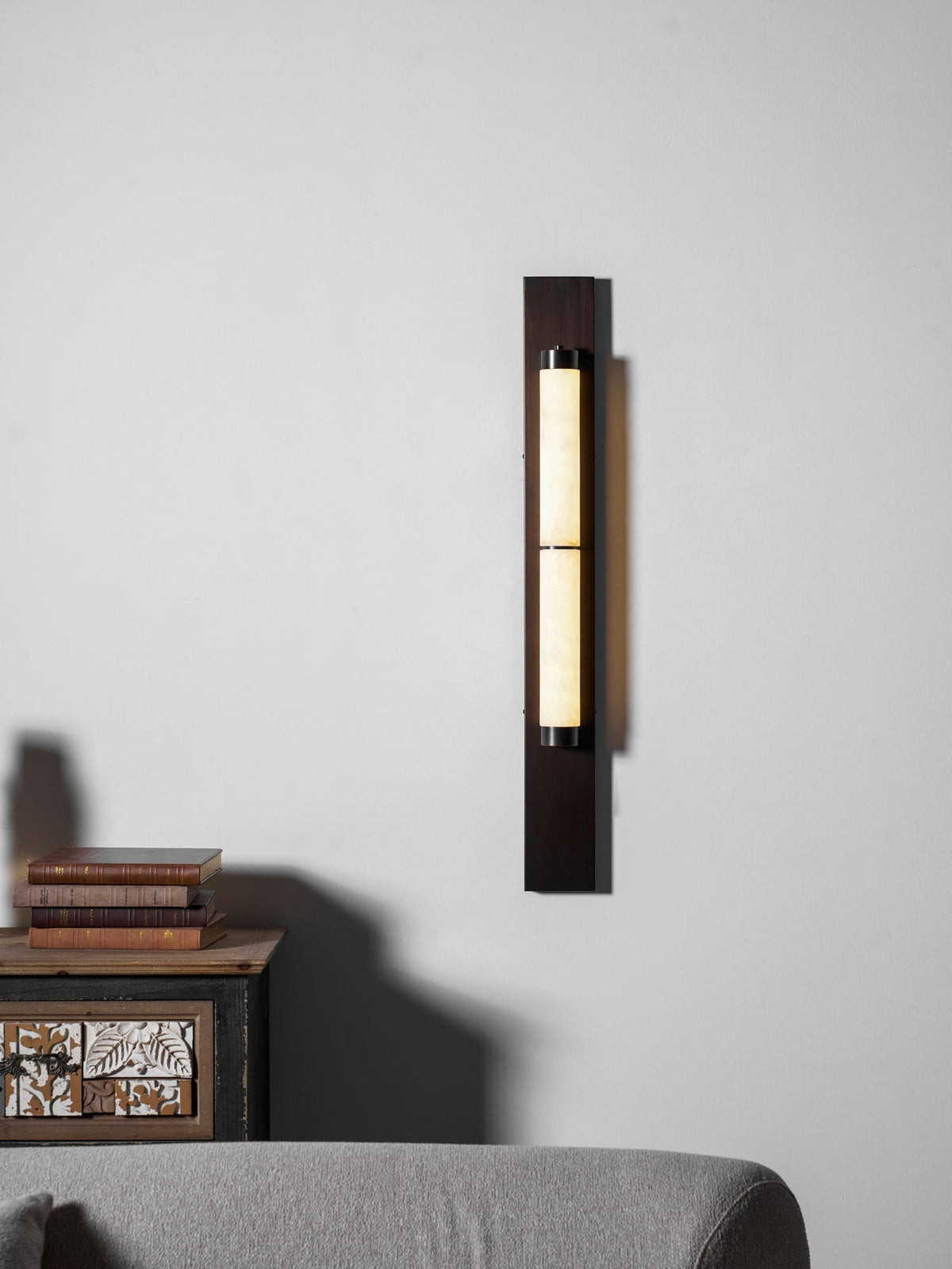 The lamp shown lit in a dimly lit room.