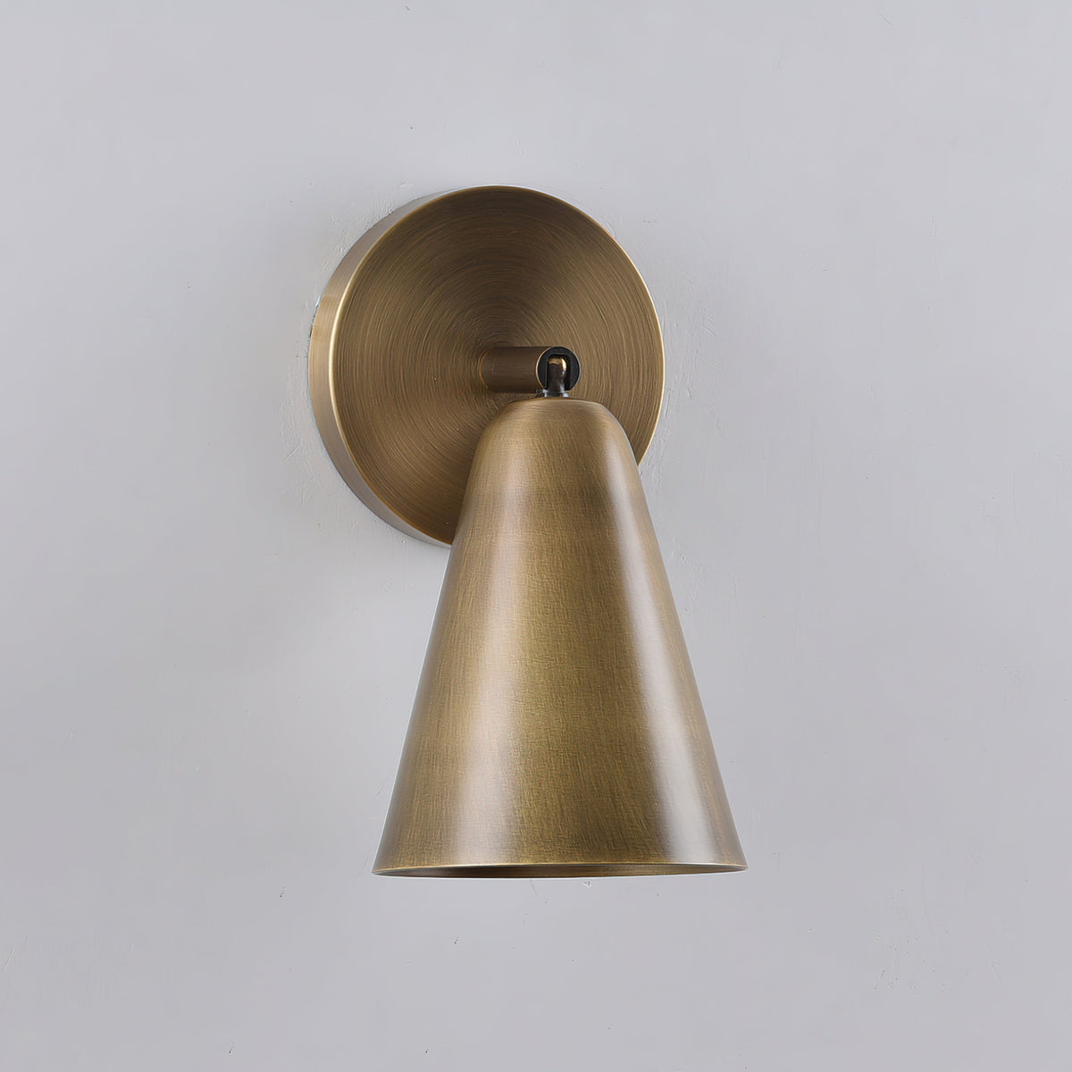 Detail of the warm light cast by the Donna Swivel Sconce.