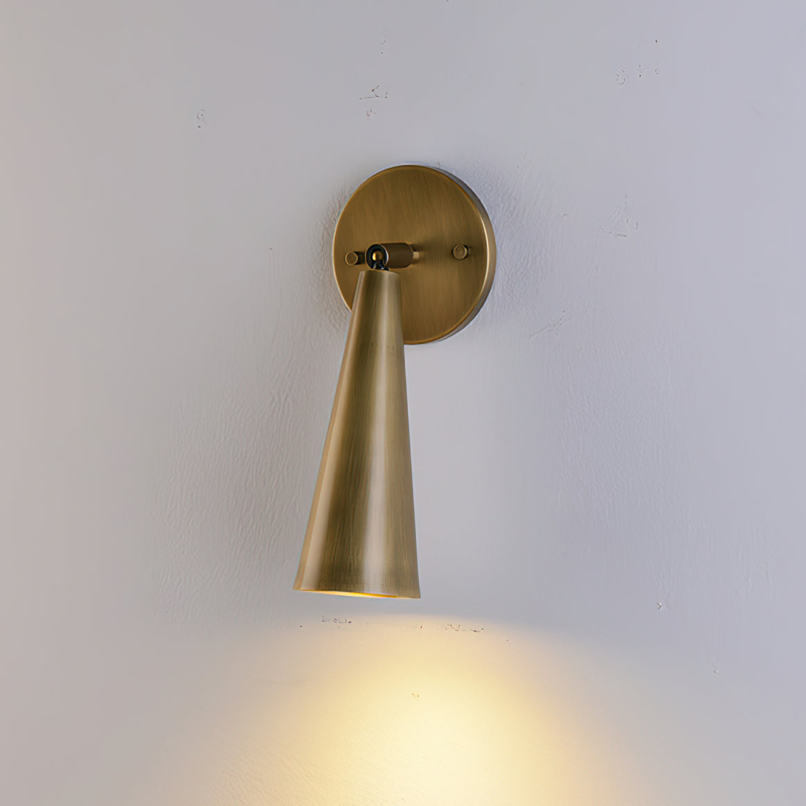 Close-up of the Donna Swivel Sconce's brass material.