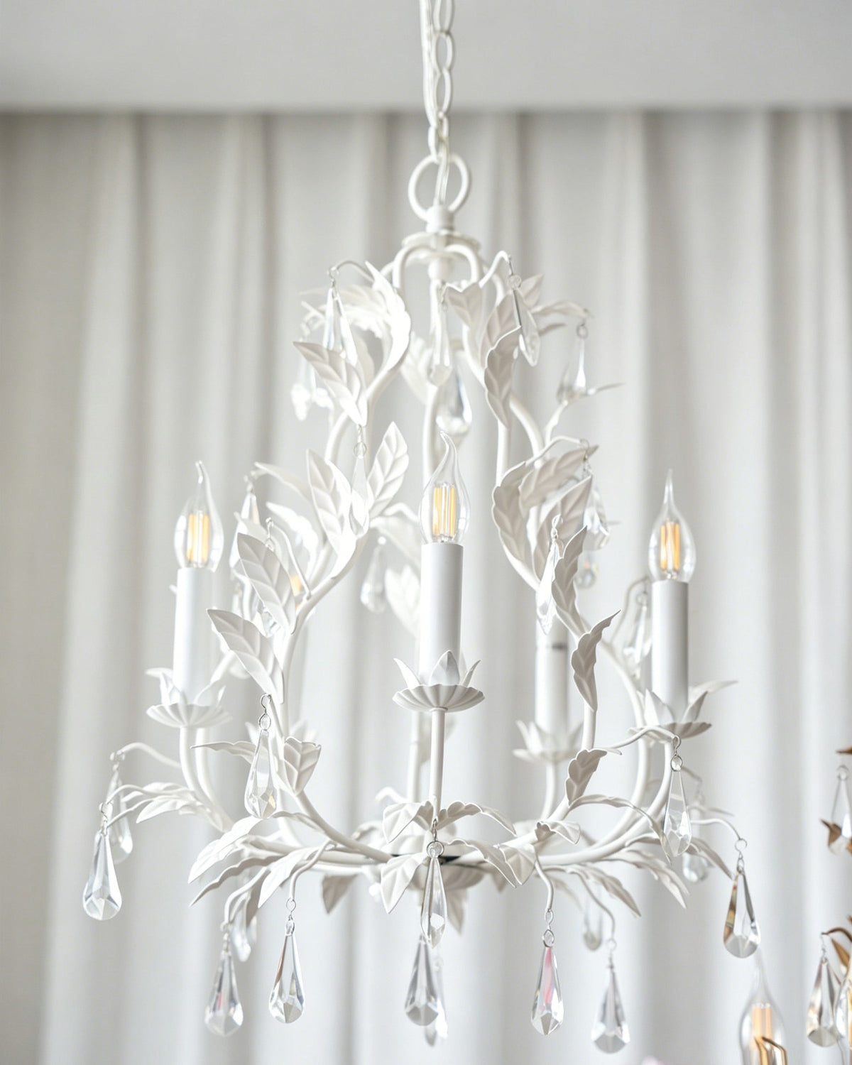 The Evie Chandelier in a European-cottage style entryway.