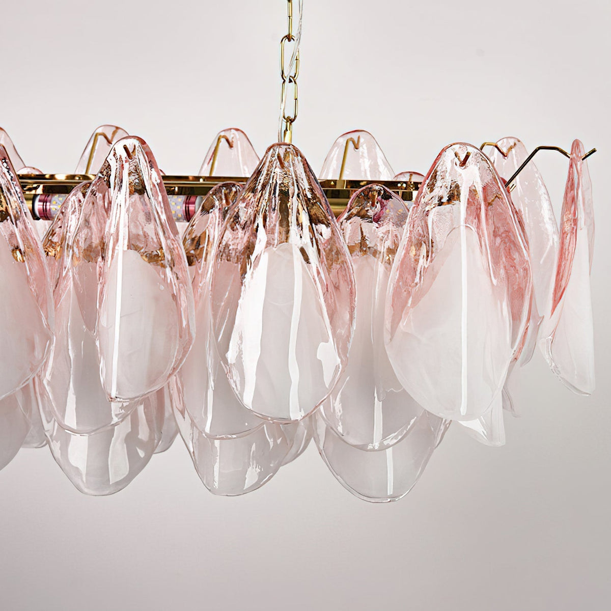 Detail shot of the E14 bulb socket nestled within the glass leaf structure.