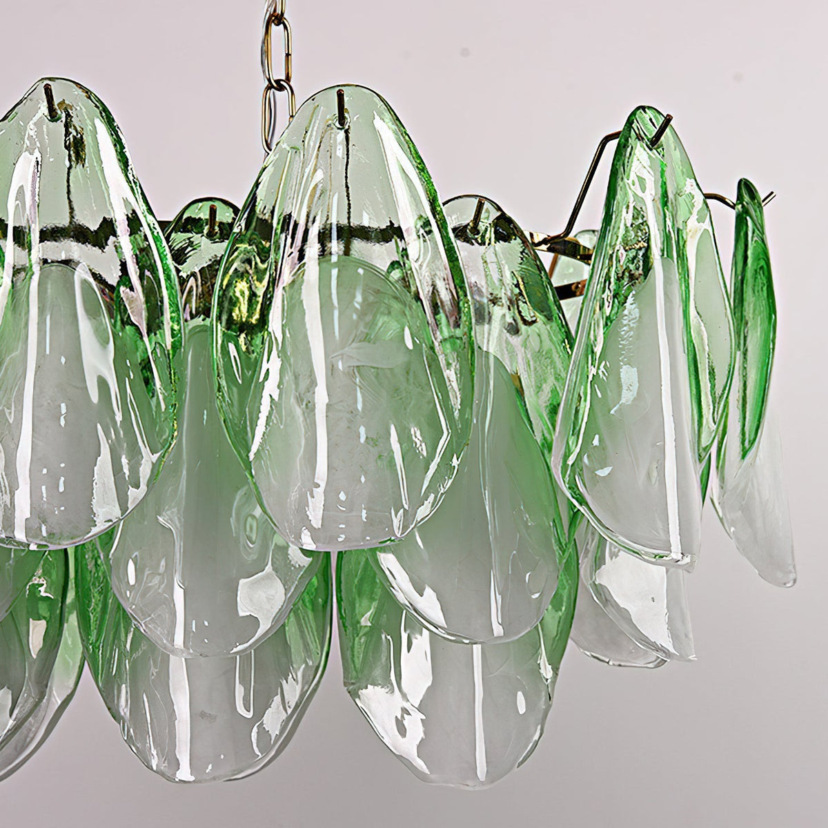 Flora linear chandelier shown in the green glass leaf color option.