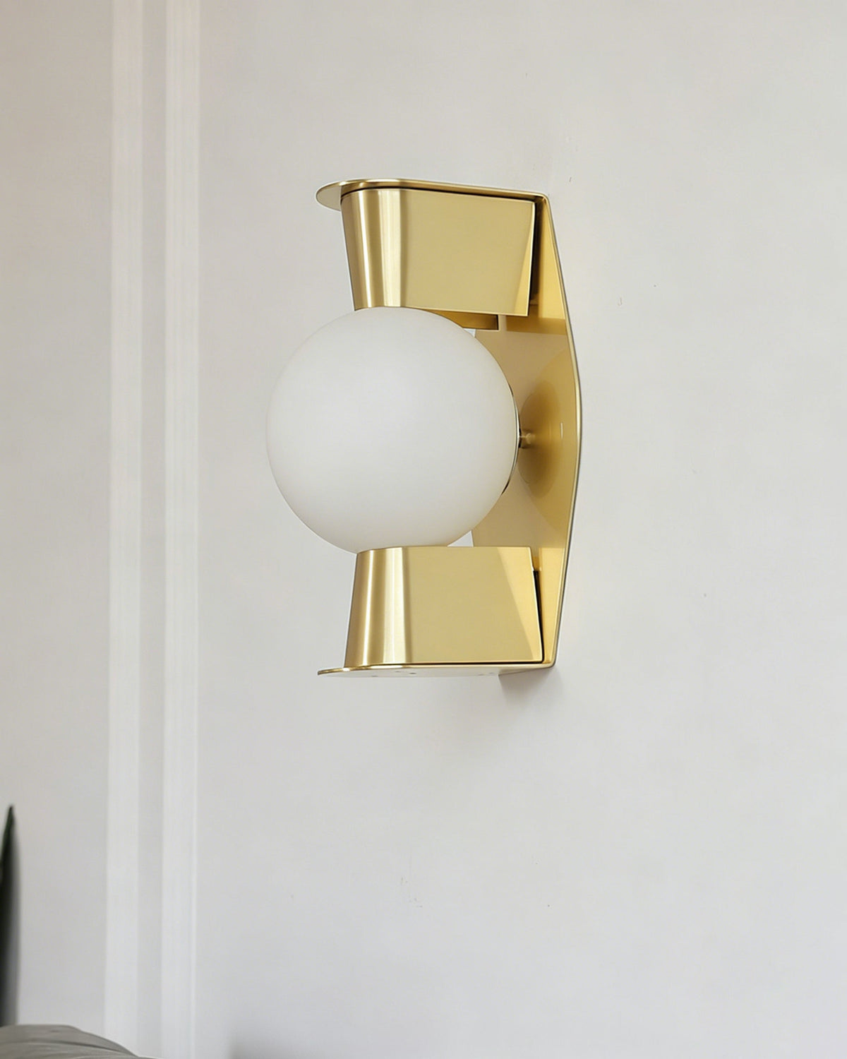 Angled shot of the Gale Globe Wall Sconce highlighting its geometric design.