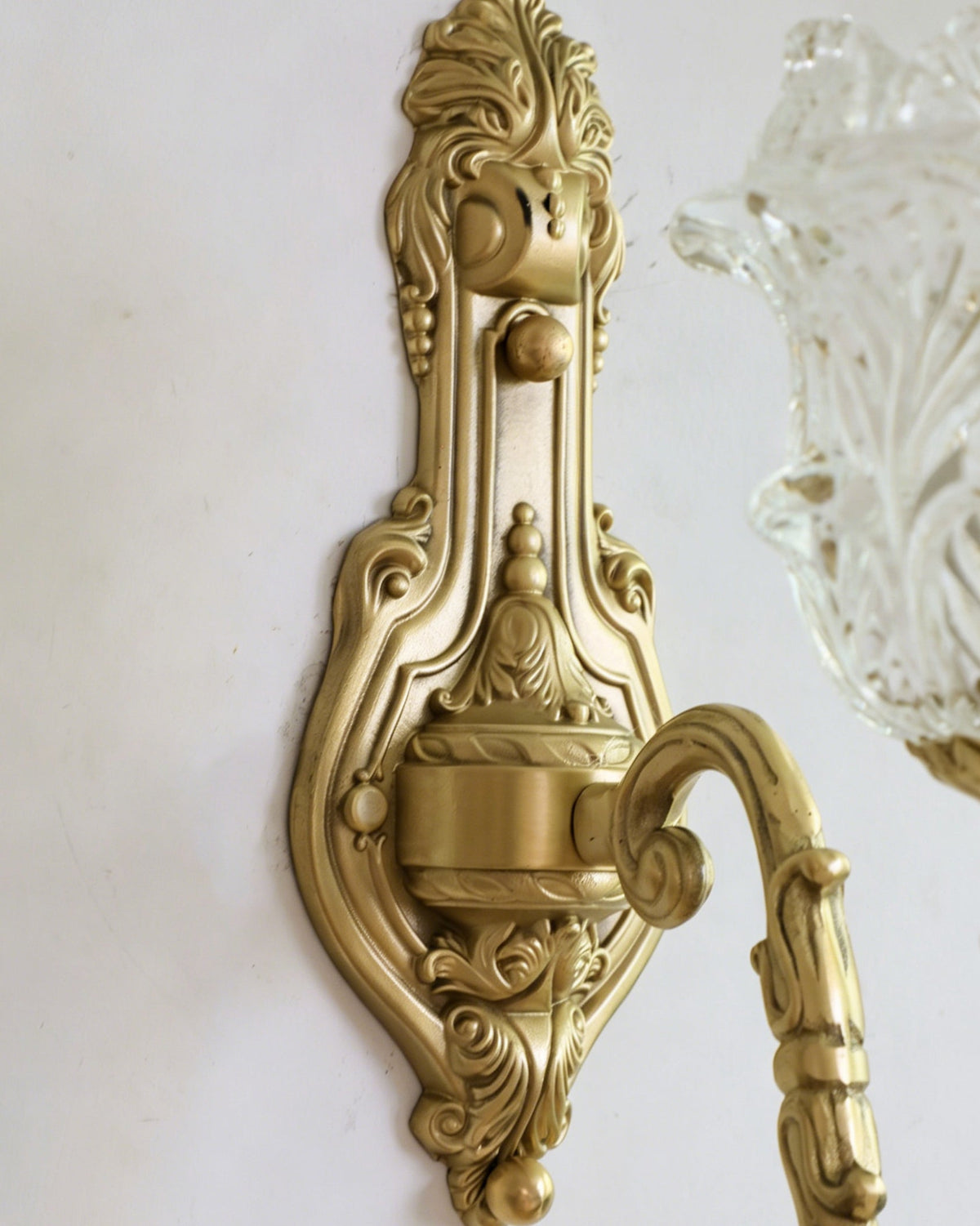 The Gideon wall light illuminated, casting a warm and inviting glow.