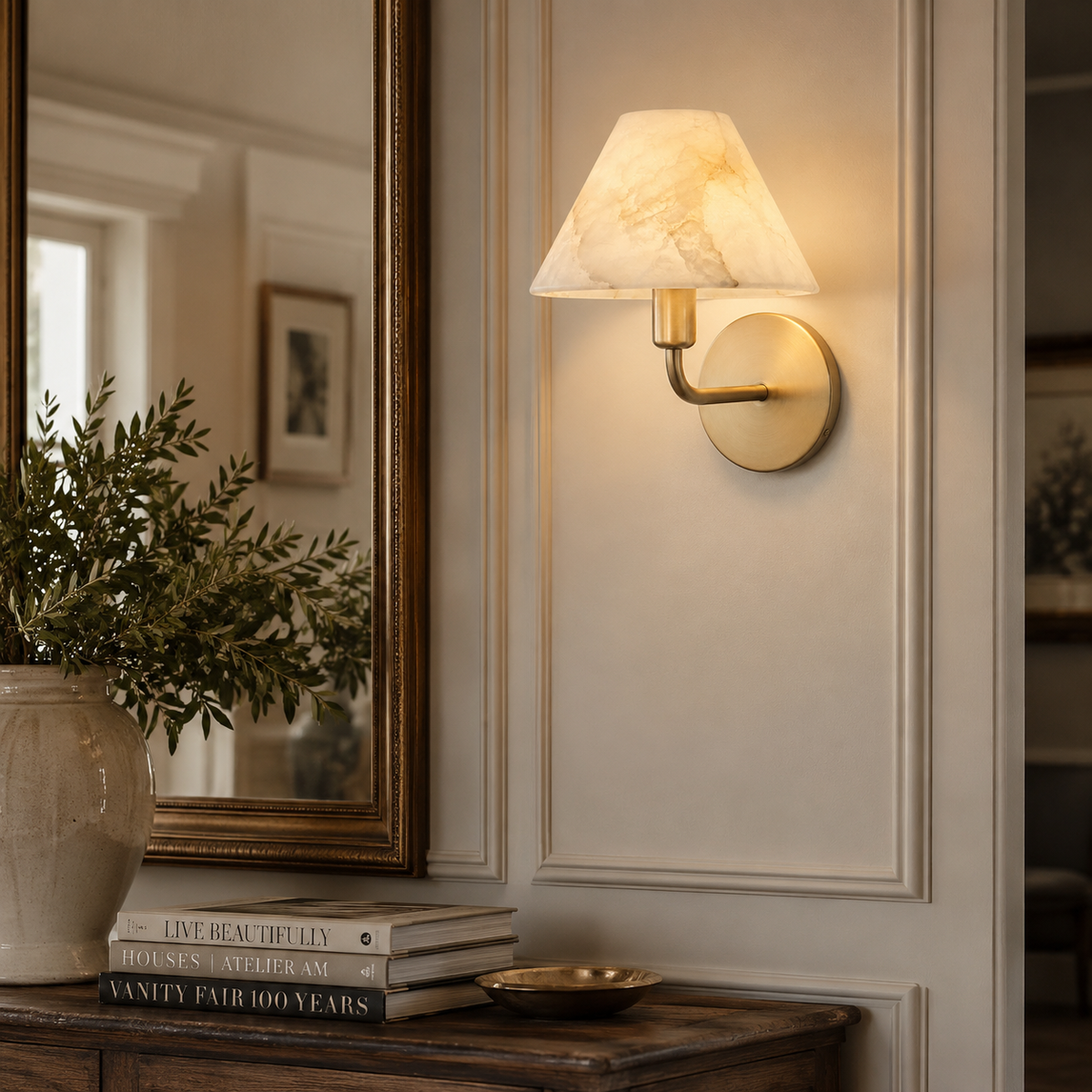 The Gilda Wall Sconce used as a sophisticated bedside reading light.