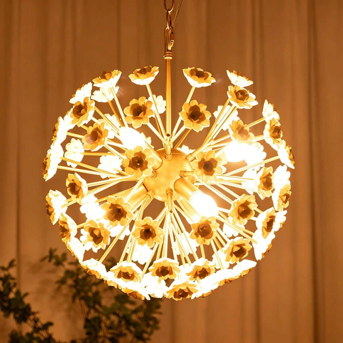 Gillian Chandelier illuminated, showing the warm glow from the candelabra sockets.
