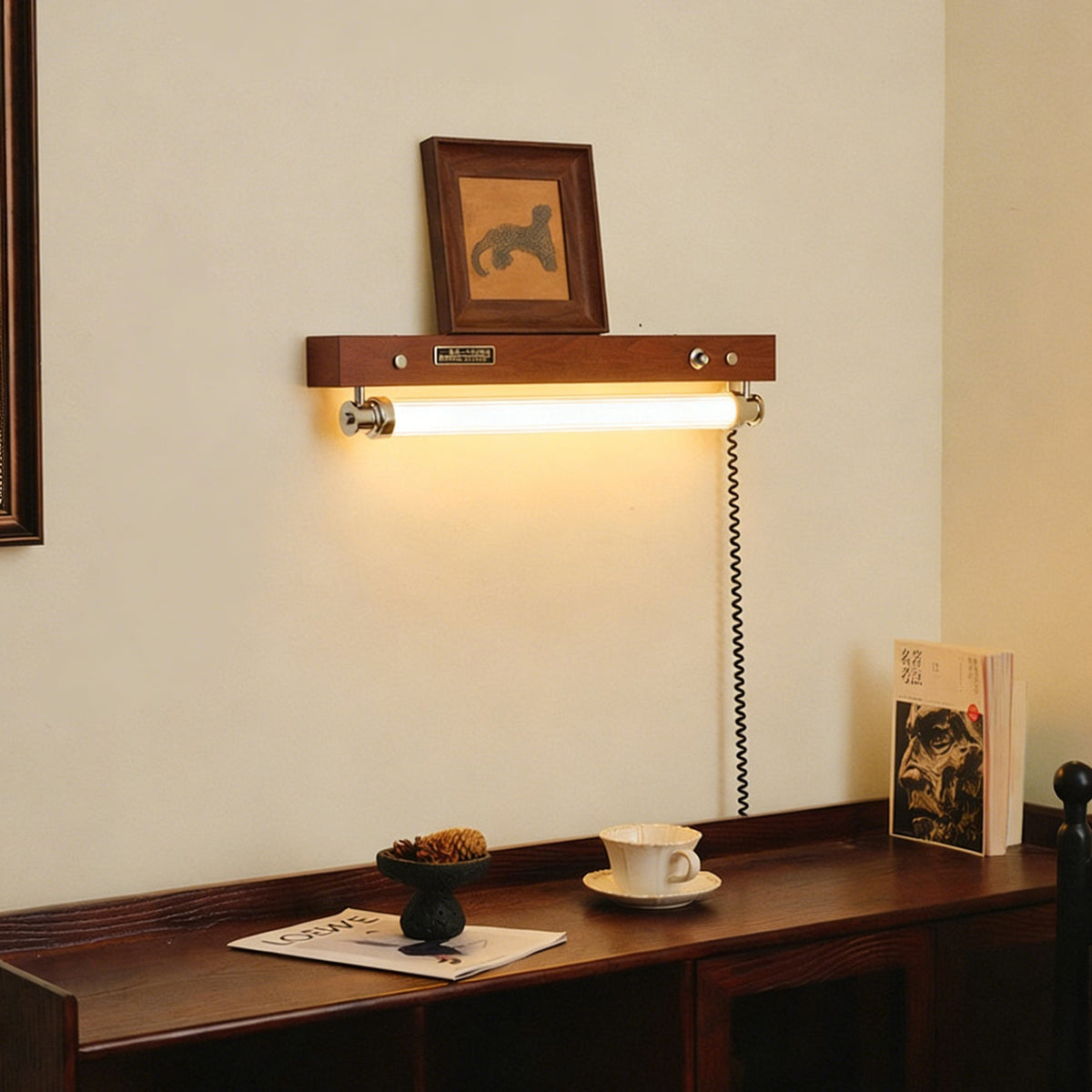 Close-up of the Hopper Wall Sconce's integrated push-button switch.