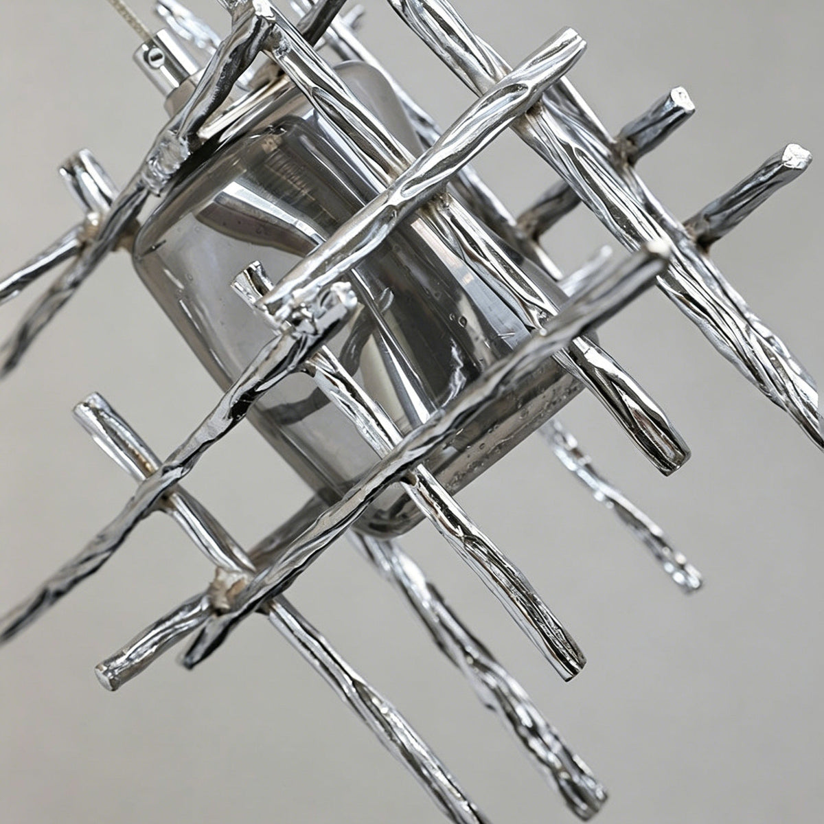 Side profile of the Kova Glass Pendant Light showcasing its cage structure.