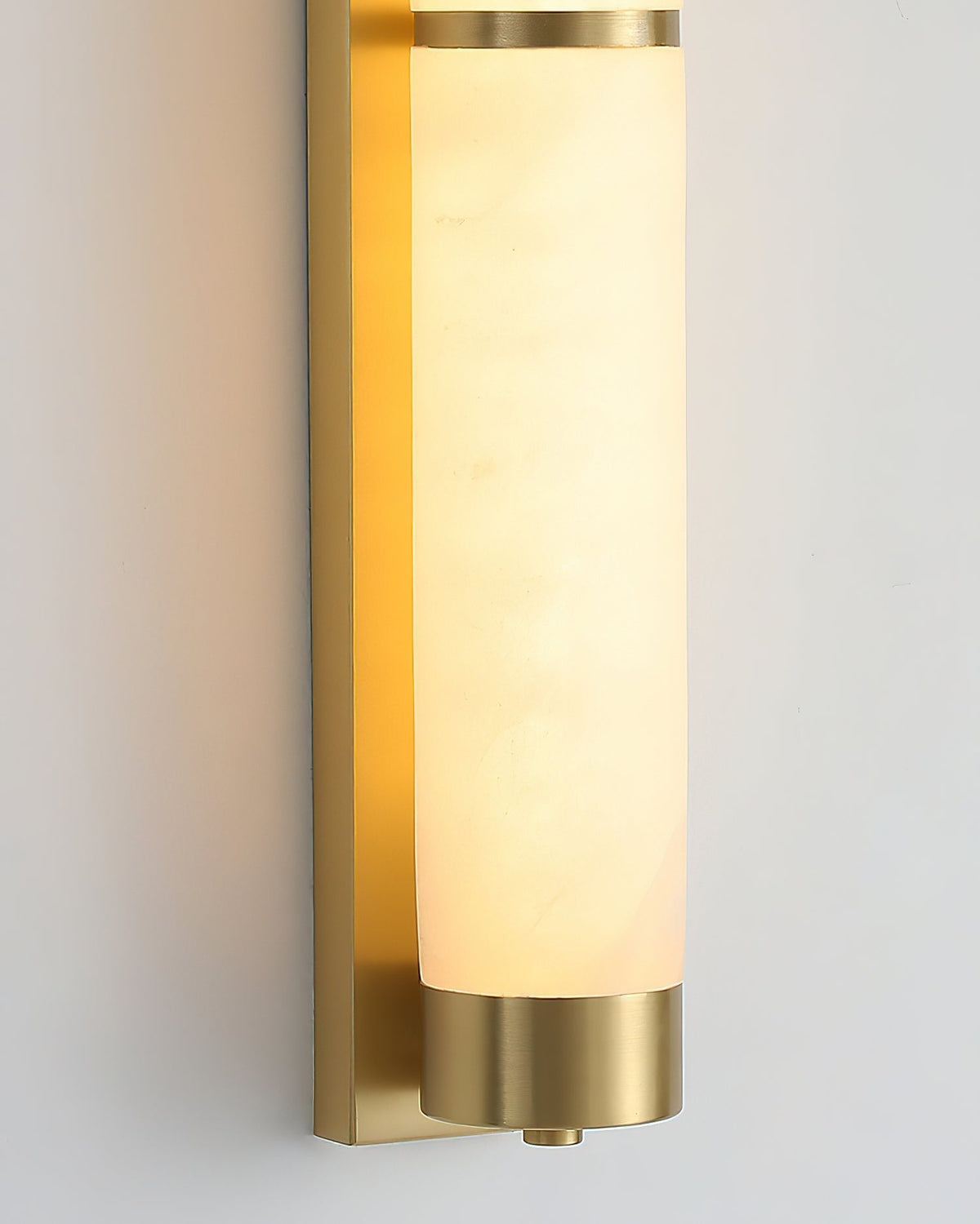 Langham sconce installed on a textured wallpaper background.