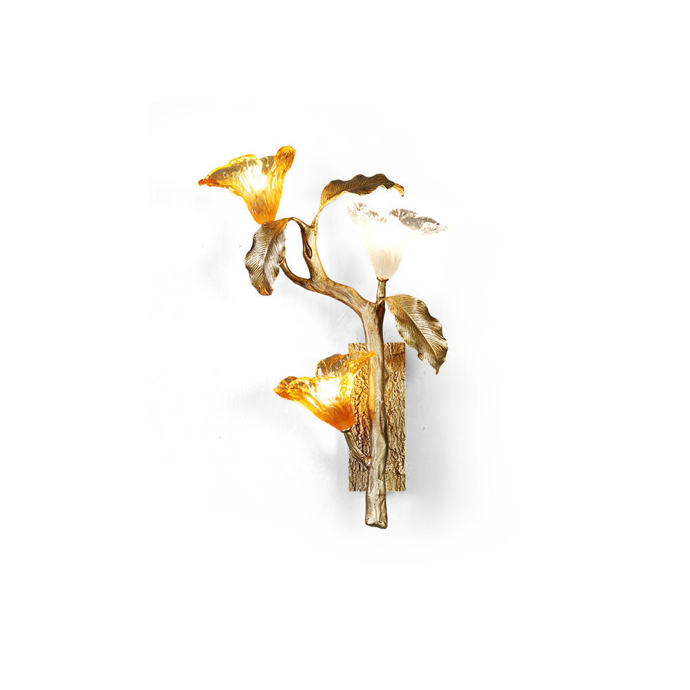 Front view of the Lily Branch Brass Sconce with three glass blooms.