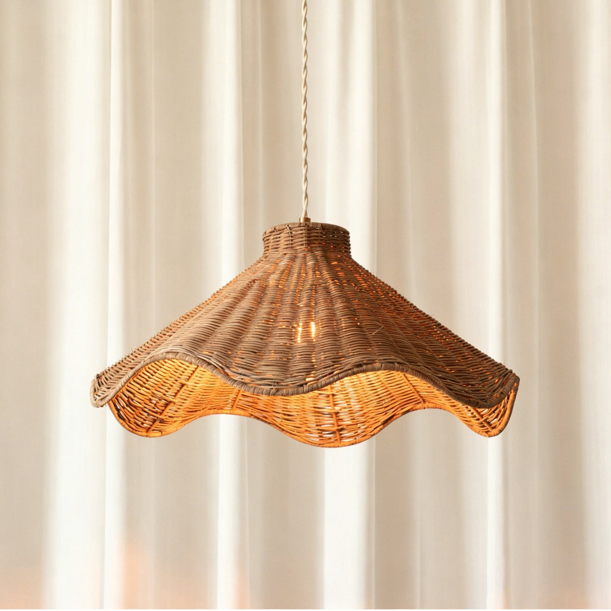 Detail shot of the cream woven textile cord and ceiling canopy.