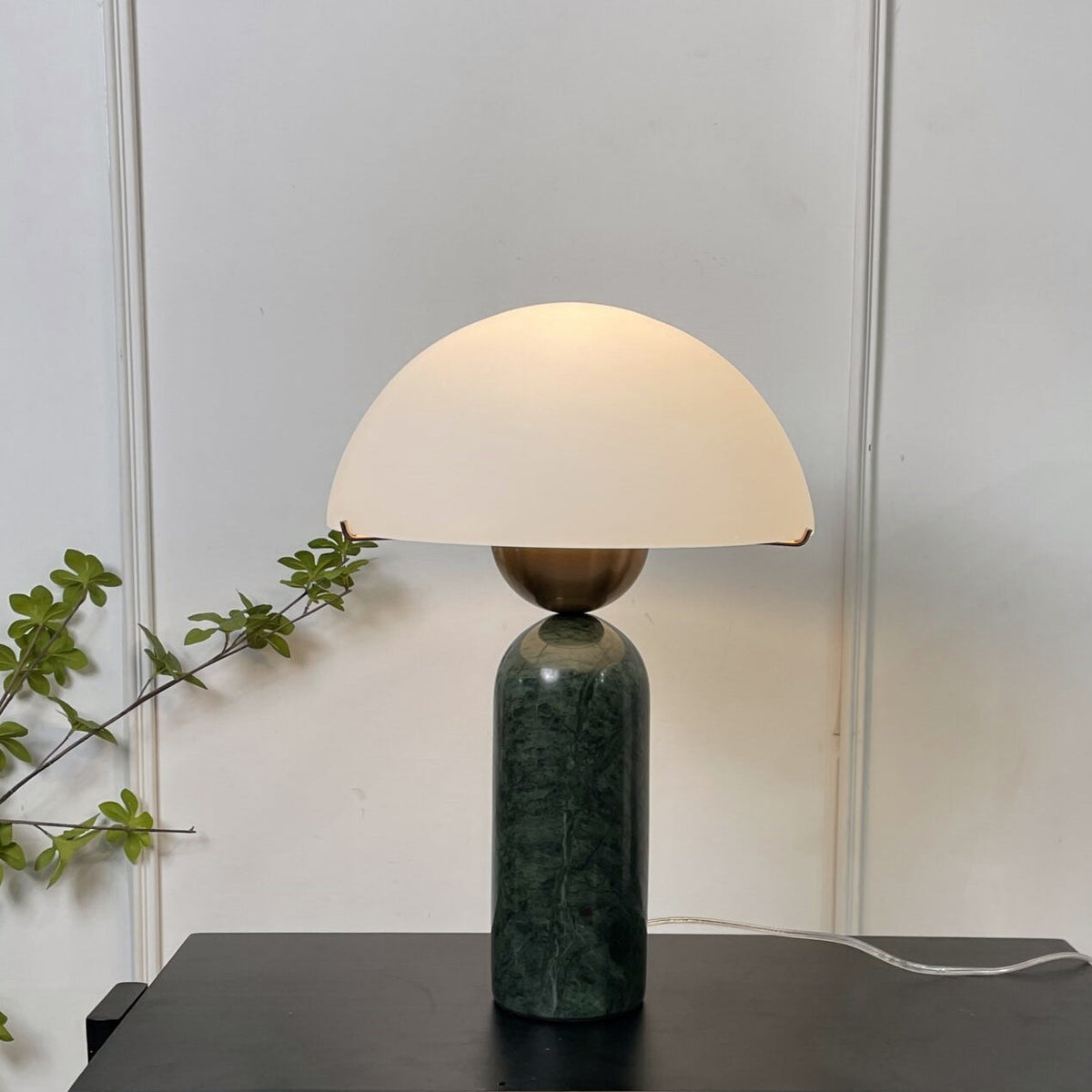 A low-angle shot of the lamp, emphasizing its sculptural height.