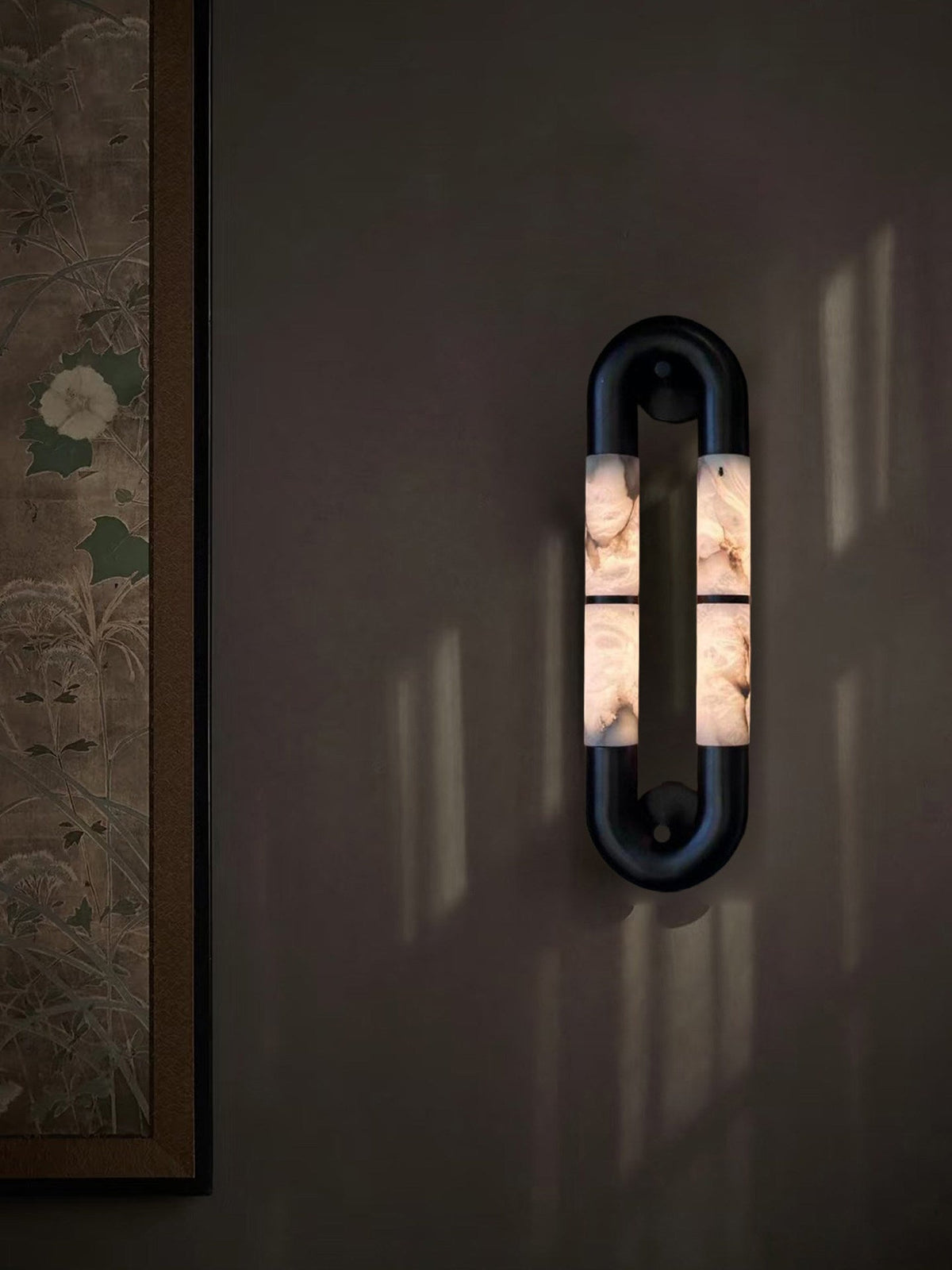 Top-down view of the wall sconce showing the flush mount design.