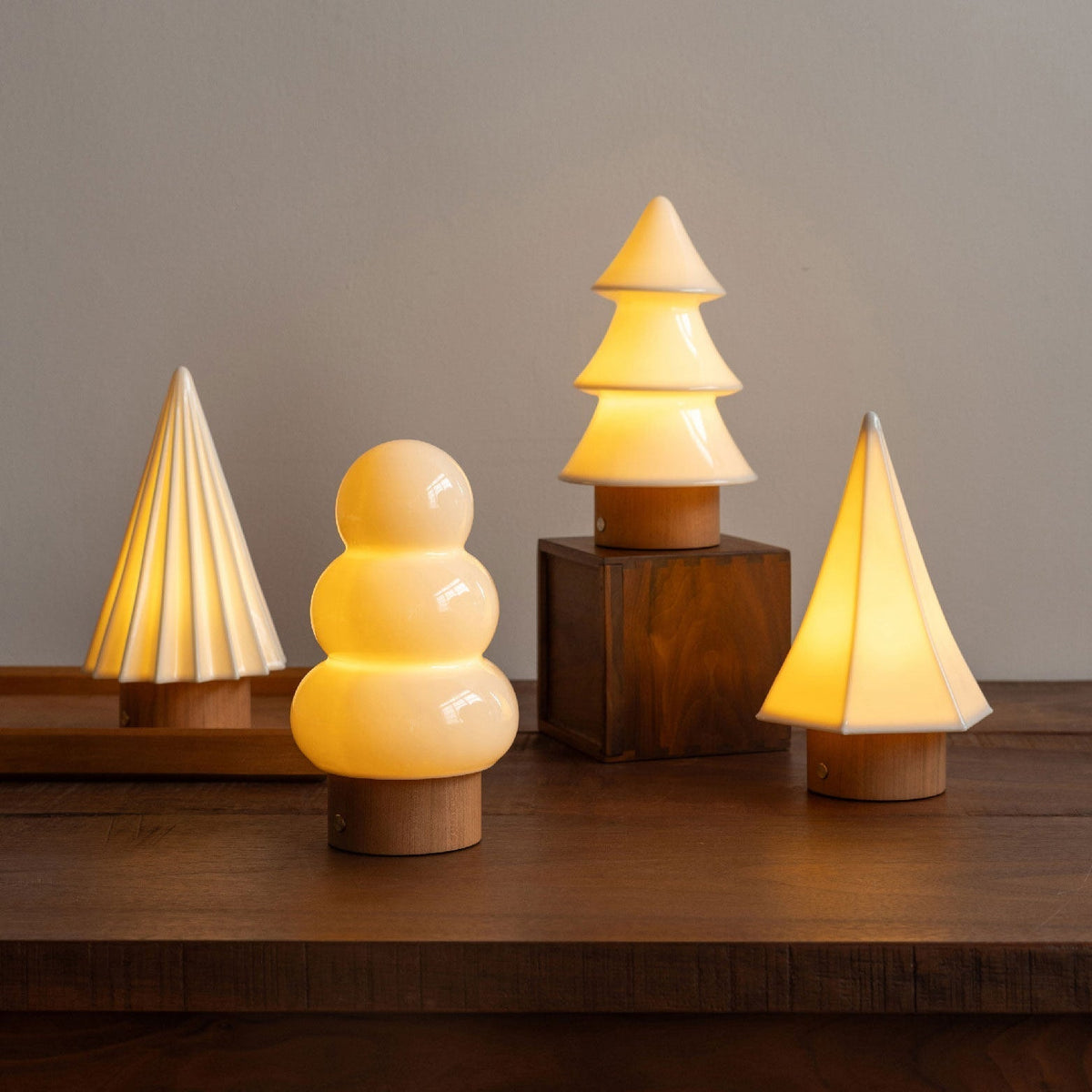 Side view of the Orlo Table Lamp, showing its three-tiered glass diffuser.