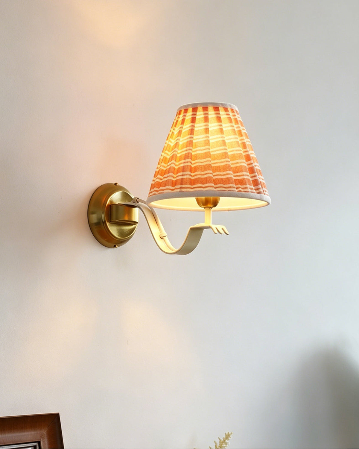 Penelope Wall Sconce shown in a cottage-style bedroom.