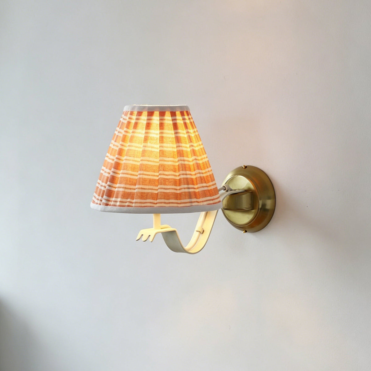 The red patterned version of the Penelope wall sconce.